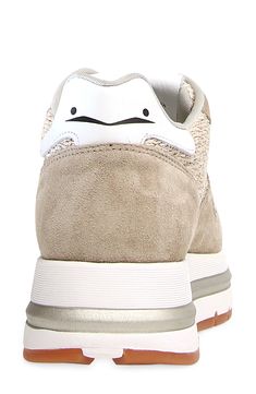 A double-stacked platform grounds this dimensional sneaker featuring mixed textures for street-savvy appeal. Lace-up style Cushioned footbed with arch support Leather and textile upper/leather lining/rubber sole Imported Beige Leather Sneakers With Speckled Midsole, Modern Beige Sneakers With Removable Insole, Beige Synthetic Sneakers With Removable Insole, Sand Beige, Up Styles, Arch Support, Womens Sneakers, Rubber Sole, Arch