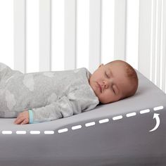 a baby is sleeping on an inflatable bed that has arrows drawn all over it