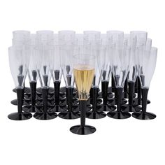 a bunch of wine glasses sitting on top of each other in front of a white background