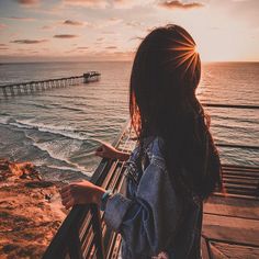 a woman looking out at the ocean with a quote about being yourself instead of tearing your tears from your eyes