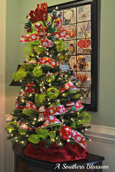 a christmas tree decorated with candy canes and bows