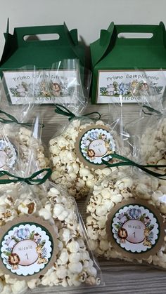 four bags filled with popcorn sitting on top of a table