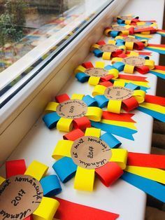 several ribbons are lined up on the window sill to be decorated with name tags