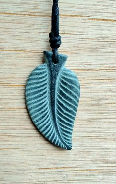 Leaf pendant, leaf necklace charm jewelry. Hand-carved from natural stone called green granite and Kenyen soapstone by myself. This pendant is inspired by the natural world. Leaf symbolizes life, growth, abundance. It's carved on the both sides.The size of the pendant is approxmatly 3cm x 2.5cm. The pendant comes with an adjustable black waxed cotton cord.Not only are these pendants a beautiful thing to wear as part of your jewellery collection, but they are also very pleasing to the touch. The Stone Carving Ideas, Soapstone Necklace, Carved Stone Jewelry, Symbol Of Success, Soap Stone, Green Granite, Element Necklace, Soapstone Carving, Hand Carved Stone