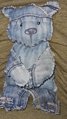 a teddy bear made out of old jeans