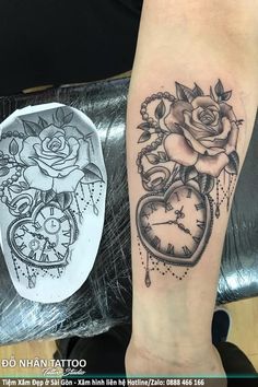 a tattoo on the arm of a woman with roses and an alarm clock in it