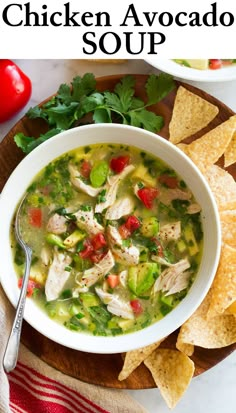 a bowl of chicken tortilla soup with tortilla chips on the side