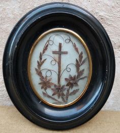 French mourning hair shadow box. Measures 16 cm. Cross with wreath constructed of hair snipits in memorandum of deceased loved one. Hair Shadow, Hair Bracelet, French Perfume, Hair Wreaths, Memento Mori, Hair Art, Shadow Box, Art Reference, Art Projects