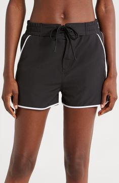 A '90s-inspired lace-up closure and dolphin hem bring some extra fun to these stretchy, high waist board shorts featuring built-in sun protection for the win. 2 1/2" inseam Zip fly with snap closure; lace-up closure Front slant pockets; back patch pocket with drainage grommet UPF 50+ sun protection 92% recycled polyester, 8% spandex Machine wash, tumble dry Imported 90s Inspired, Back Patch, Board Shorts, Upf 50, Snap Closure, Sun Protection, Patch Pocket, High Waist, Built In