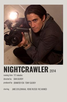 a man holding a camera in front of his face with the words nightcrawler on it