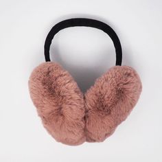 Your favorite childhood accessory, all grown up! Made with super-soft faux fur (it feels like chinchilla, but trust us, it's not!) and a comfortable velvet-covered headband, these oversized earmuffs keep you warm without messing up your hair. Since we release these earmuffs in 2018, they've been a top seller. One of our favorite things at in-person markets is watching groups of friends and families try them on. It's instant smiles and laughter-- they're fun, fabulous, and statement piece. See al Fur Earmuffs, Jump For Joy, Rose Stone, Jumping For Joy, All Grown Up, Black Faux Fur, Earmuffs, Top Seller, Grown Up