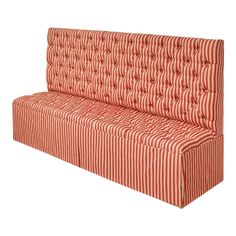 a red and white striped couch sitting on top of a white floor