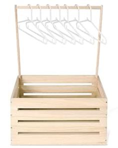 a wooden box with clothes hangers on the top and bottom, in front of a white background