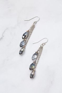 Discover the beauty and versatility of the Reflections Collection! Every piece is meticulously handcrafted with carefully selected materials. These tassel earrings perfectly complement the collection, adding an elegant touch to your style. Elevate your look with Reflections! Antique Silver Plated Brass (Lead & Nickel Free) Crystal 2.5" with sterling silver ear wires We hand select our natural materials, thus there may be slight variations in color and/or size that will not detract from the overa Elegant Tassel Teardrop Earrings, Elegant Teardrop Tassel Earrings, Elegant Silver Tassel Earrings With Dangling Beads, Elegant Handmade Silver Tassel Earrings, Elegant Handmade Long Drop Tassel Earrings, Elegant Long Drop Handmade Tassel Earrings, Elegant Beaded Dangle Earrings With Tassels, Elegant Silver Beaded Earrings With Latkans, Floyd Va