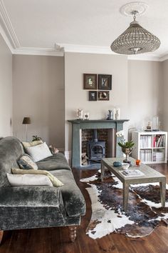 a living room filled with furniture and a fire place