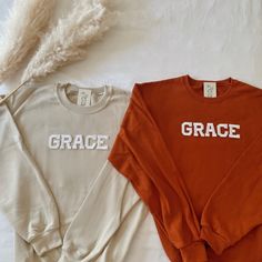 This Grace Crewneck Sweatshirt is the perfect Religious/Christian sweatshirt to declare your faith! A great for your family, friends, or Christian loved ones. - They need to be purchased individually (it's not sold as a set) - Sweatshirt material is super soft and comfy! ♡ - All our sweatshirts run a UNISEX fit. (Both for men and women). They are naturally oversized, so we normally recommend your true size. But if you like a more baggy look, we recommend sizing up. - These letters are iron-on pa Custom Text Sweatshirt With Relaxed Fit For Fall, White Cotton Sweater With Name Print, White Family Matching Sweatshirt For Fall, Family Matching White Sweatshirt With Custom Text, White Fall Sweater With Name Print, Family Matching Custom Text White Sweatshirt, Family Matching Cotton Sweatshirt With Custom Text, White Sweater With Name Print For Fall, Cotton Crew Top With Custom Text