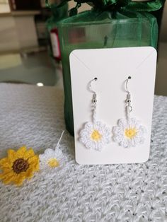 Beautiful crochet daisy earring with cotton and silver hook. Handmade in a pet free and smoke free environment/ Beautiful crocheted daisy flower earring made with cotton thread and silver hook. Handmade in a pet-free and smoke-free environment. Handmade Daisy-shaped Earrings For Gifts, Handmade Daisy Earrings As Gift, Handmade Daisy-shaped Earrings As Gift, Handmade Daisy Shaped Earrings As Gift, Handmade Daisy White Earrings, Handmade White Daisy Earrings, Handmade Daisy Jewelry For Summer, Handmade Daisy-shaped Summer Jewelry, Summer Daisy Flower Earrings Gift