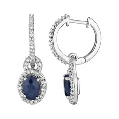 Beautifully adorned with oval-cut sapphires and scintillating diamonds, these 10k white gold drop earrings elegantly enhance your favorite evening attire.EARRING DETAILSLength: 21.00 mmBackings: hingeMetal: 10k white goldFinish: polishedPackaging: boxedSTONE DETAILSStone type: sapphire Total weight: 1 ct.Center stone size: 6 mm x 4 mmShape: ovalSetting: prongDIAMOND DETAILSTotal weight: 1/4 ct.Color grade: I-JClarity: I2-I3Shape: roundSetting: prongGemstones may have been treated to enhance thei Classic Oval Sapphire Diamond Earrings, Sapphire Color Oval Diamond Earrings, Sapphire Oval Diamond Earrings, Oval Sapphire Diamond Earrings For Anniversary, Oval Sapphire Earrings With Diamond Accents, Oval White Gold Diamond Earrings Fine Jewelry, Oval White Gold Diamond Earrings, Oval White Gold Diamond Earrings In Sterling Silver, Oval Sterling Silver Diamond Earrings