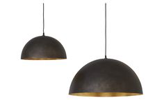 two black and gold pendant lights hanging from the ceiling, one with an oval shaped light fixture