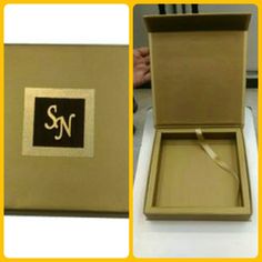 an open box with the letter sn on it, and two pictures of its inside