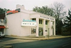 a white building with a sign on the front