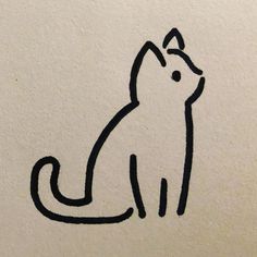 a drawing of a cat sitting on top of a white wall