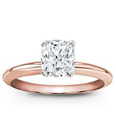 a rose gold engagement ring with a cushion cut diamond