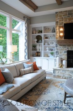 a living room filled with furniture and a fire place