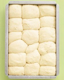 a pan filled with dough sitting on top of a green table