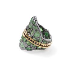 Celebrating the wonders of nature, this German Kabirski designer ring features raw tsavorite crystals and cut black spinel. Crafted from sterling silver and plated with black rhodium and 18K gold, it uses the innovative Stained Glass technique to highlight the untouched beauty of the raw tsavorite. The striking line of cut black spinel adds contrast and elegance. Perfect for those who feel a connection to Earth's ancient history and marvel at its artistry, this one-of-a-kind piece embodies authentic self-expression through modern jewelry design. Metal: 925 Silver Stones: Rough Tsavorite, Spinel Plating: Black Rhodium, 18K Gold  PLEASE NOTE: The raw gemstones have natural imperfections such as cracks and color spots, which are signs of authenticity. They may also appear differently under va Luxury Tsavorite Jewelry With Gemstone Accents, Luxury Tsavorite Ring Jewelry, Luxury Tourmaline Jewelry With Rose Cut Diamonds, Tsavorite Jewelry With Gemstone Accents As Gift, Tsavorite May Birthstone Ring, Tsavorite Gemstone Jewelry For May Birthstone, Black Spinel Jewelry With Rose Cut Diamonds For Gift, Gift Jewelry With Rose Cut Diamonds And Black Spinel, Tsavorite Ring Jewelry