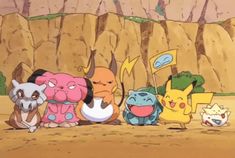 the pokemon characters are all lined up in front of a mountain side area with rocks and grass