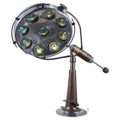 an old fashioned lamp with many lights on it