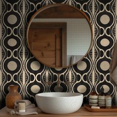 a bathroom sink with a mirror above it and other items on the counter in front of it