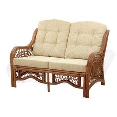 a wicker loveseat with two cushions on top of the seat and back