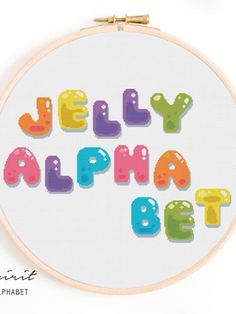 a cross stitch pattern with the words jelly alphabet in bright colors on a white background