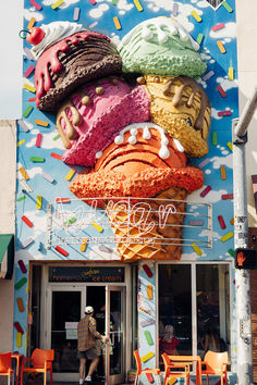 a giant ice cream cone with sprinkles on it's face and mouth