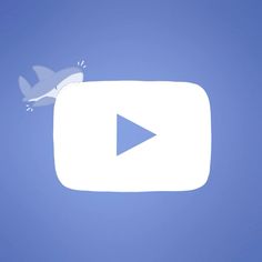 a bird flying in the air with a video player button on it's side