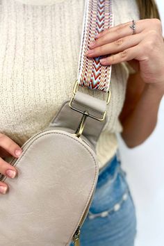 Super functional and oh-so-cute, the Sutton Sling Crossbody features multiple pockets to keep everything you need just a zipper away. The front compartment snaps closed and reveal three card slots when open—perfect for when you don't want to carry a full wallet. Silky smooth vegan leather and brushed gold hardware tie it all together. Details: 14.5” long x 6.5” wide x 2.5” deep The strap adjusts up to 47” long Trendy Chest Bag With Adjustable Strap For On-the-go, Trendy Crossbody Bag Strap With Cell Phone Pocket, Trendy Chest Bag With Adjustable Strap For Travel, Casual Beige Bag Strap For Travel, Beige Crossbody Belt Bag With Cell Phone Pocket, Beige Crossbody Chest Bag With Adjustable Strap, Adjustable Shoulder Bag With Zipper For On-the-go, Adjustable Zipper Closure Shoulder Bag For On-the-go, Beige Crossbody Chest Bag With Zipper Pocket