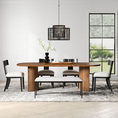 a dining room table with four chairs around it