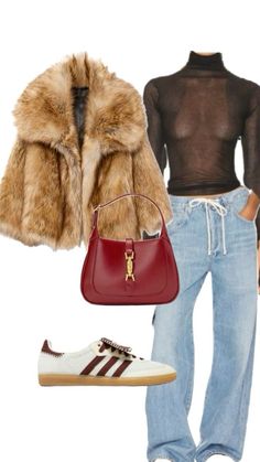 a woman wearing jeans and a fur coat is holding a red handbag while standing in front of a white wall