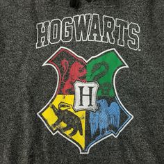 the hogwarts crest on a hoodie with an image of two headed animals