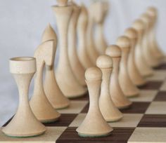 chess pieces lined up on a checkered board