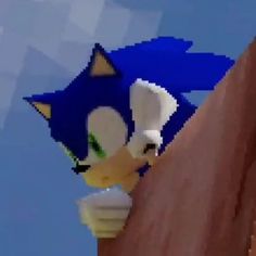 sonic the hedgehog is leaning against a wall with his head on top of it