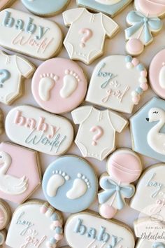 baby shower cookies are displayed on a table