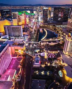 an aerial view of the las vegas strip at night with lights on and buildings lit up