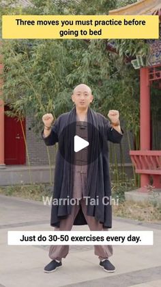 a man standing in front of a building with his hands up and the words warrior tai chi