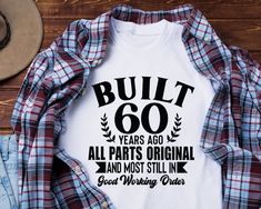 a shirt that says built 60 years ago, all parts original and most still have good working order