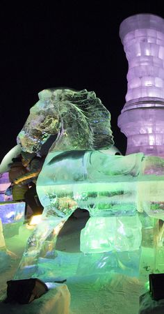 an ice sculpture that looks like it is made out of ice and has many different colored lights