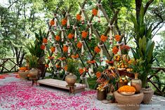 an outdoor ceremony with flowers and candles