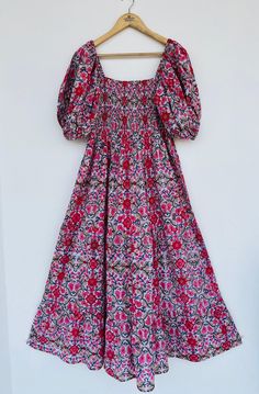 Cotton fabric, shirred bodice, long dress, hand block printed fabric Women's cotton dress, bohemian smocked long dress, Indian cotton maxi, hand block print cotton gown, ruffle sleeves floral long dress, hippie dresses, cotton maxi, long maxi, comfortable dress, smocking maxi dress, ruffle dresses, summer dresses, floral dress, boho dresses, vintage gown Feel beautiful and confident throughout your days wearing our block printed outfits, made with high quality soft and breathable cotton fabric. Multicolor Cotton Smocked Dress With Floral Print, Multicolor Floral Print Cotton Smocked Dress, Multicolor Floral Print Bohemian Smocked Dress, Multicolor Bohemian Smocked Dress With Floral Print, Multicolor Bohemian Smocked Dress, Cotton Maxi Smocked Dress, Bohemian Cotton Maxi Dress With Smocked Back, Bohemian Smocked Maxi Dress With Cuffs, Bohemian Smocked Maxi Dress With Smocked Cuffs